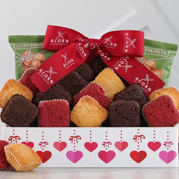 Box of assorted cookies with a red ribbon, branded 'Acorn Baking Co', on a light gray background.