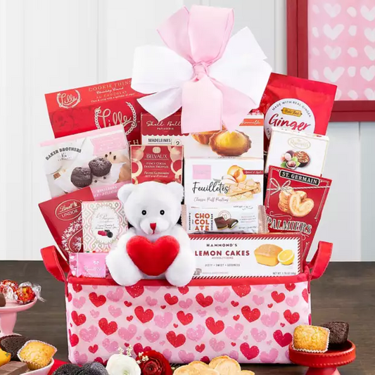 Valentine's Day gift basket with a teddy bear, cookies, and heart-themed packaging.